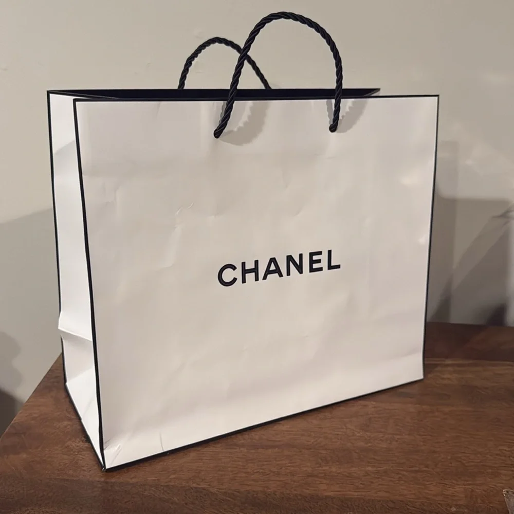 Authentic CHANEL gift bag. 10.5 x 9 x 4.5 in. White with logo in black